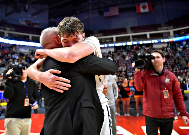 Central York head coach Jeff Hoke, left, and senior player Greg Guidinger celebrate a 53-51 win over Parkland during PIAA Class 6A boys’ basketball championship action at Giant Center in Hershey, Saturday, March 23, 2024. (Dawn J. Sagert/The York Dispatch)