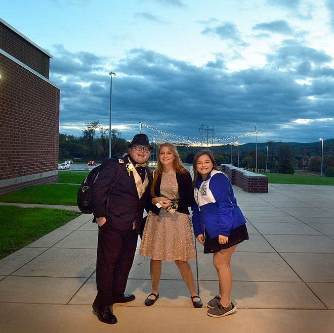 Lane Smith, left, Emily Ramsay and Chloe Smith arrived at the dance early-- and were first in line to the open doors. Spring Grove Area High School's homecoming dance Saturday, Oct. 21, 2023 saw a crowd of 920 students dancing. Bil Bowden photo