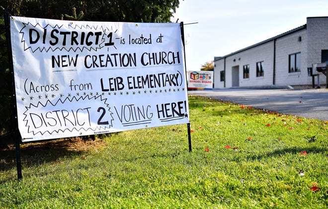 A sign notifies viewers that the District 2 polling location was moved to New Creation Church from it’s previous location alongside District 1 inside the Dover Community Center, during Election Day in Dover Township, Tuesday, Nov. 7, 2023. (Dawn J. Sagert/The York Dispatch)
