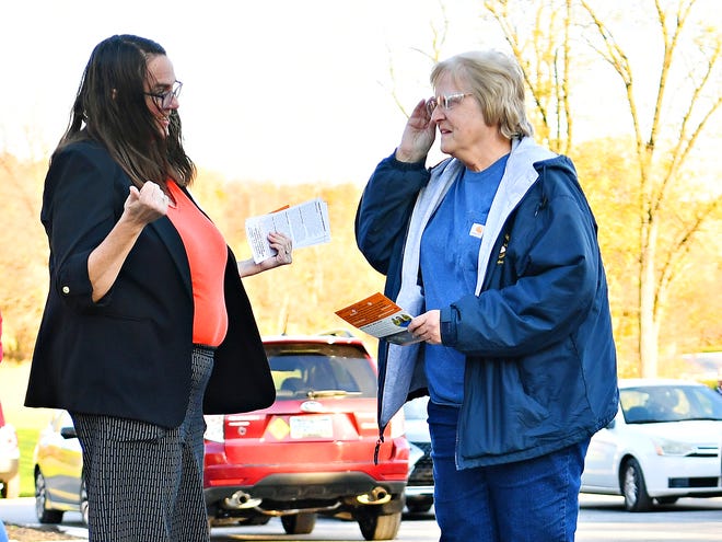 Central York School Board candidate Wendy Crane, left, greets voters at the Commonwealth Fire Co No. 1 Station 893 polling location during Election Day in Springettsbury Township, Tuesday, Nov. 7, 2023. (Dawn J. Sagert/The York Dispatch)
