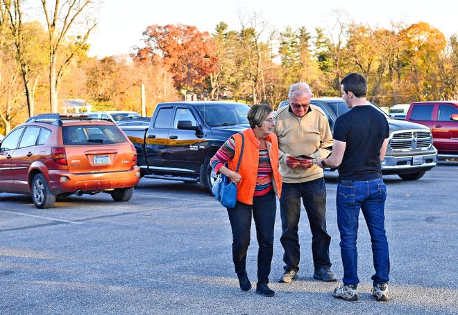From right, Central York School Board candidates supporter David Krebs, of York Township, greets voters Bill and Judy Sonnenberg, of Springettsbury Township, as they arrive to cast their ballots at their Commonwealth Fire Co No. 1 Station 893 polling location during Election Day in Springettsbury Township, Tuesday, Nov. 7, 2023. (Dawn J. Sagert/The York Dispatch)