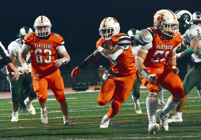 Central York's Juelz Goff (0) is runs past offensive lineman Mitchel Myers (63) and into the end zone during the Panthers' District 3 Class 6A playoff game against Central Dauphin on Friday, Nov. 10, 2023, in Springettsbury Township. Central York won, 42-34, in a back-and-forth battle.