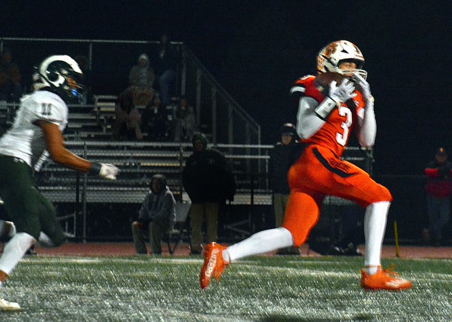 Central York's Ethan Carlos (3) runs away from a Central Dauphin defender and under a pass for a touchdown, giving Central York a 34-28 lead during the teams' District 3 Class 6A playoff game Friday, Nov. 10, 2023, in Springettsbury Township. Central York won, 42-34, in a back-and-forth battle.