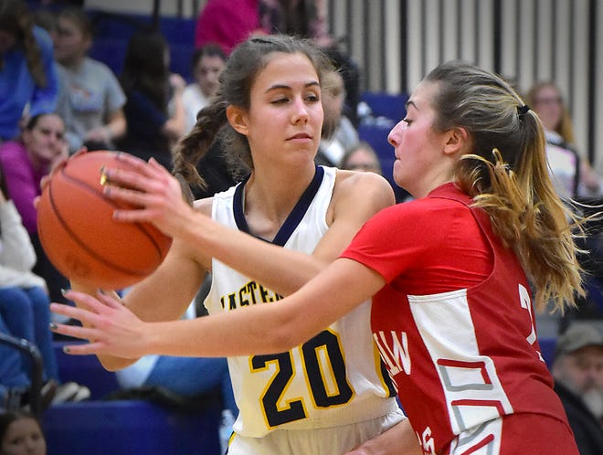 Eastern York's Annika Lipsius (20) controls the ball against tight Bermudian Springs defense during the Eastern York Girls' Basketball Rotary Club Holiday Tournament in Wrightsville on Thursday, Dec. 28, 2023. The host Golden Knights beat the Eagles, 59-51, to win the title.