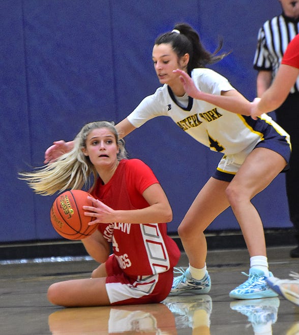 Bermudian Springs' Victoria Bross, left, looks to pass as Eastern York's Arianna Seitz (4) defends during the Eastern York Girls' Basketball Rotary Club Holiday Tournament in Wrightsville on Thursday, Dec. 28, 2023. The host Golden Knights beat the Eagles, 59-51, to win the title.