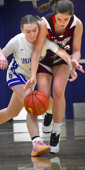 Spring Grove's Emersyn Toomey, left, battles Shippensburg's Lucia Lorente for the ball during the Eastern York Girls' Basketball Rotary Club Holiday Tournament in Wrightsville on Thursday, Dec. 28, 2023. The Rockets dropped the consolation game to the Greyhounds, 50-42, in overtime.