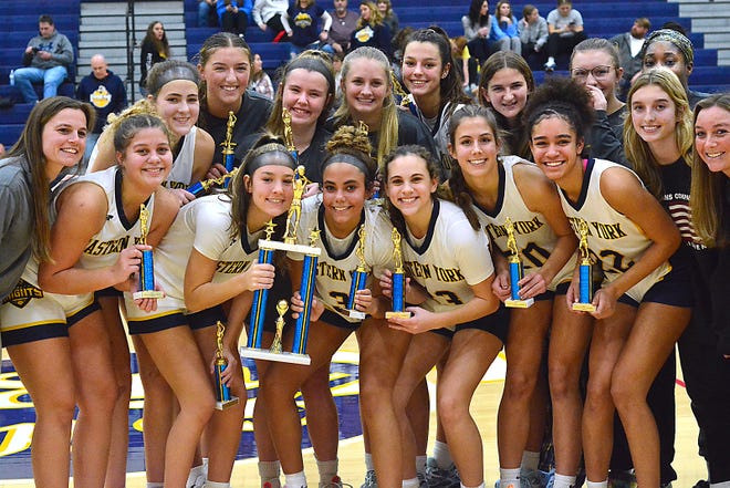 Eastern York girls' basketball players pose with the trophy after beating Bermudian Springs, 56-51, to win the Eastern York Girls' Basketball Rotary Club Holiday Tournament championship in Wrightsville on Thursday, Dec. 28, 2023.