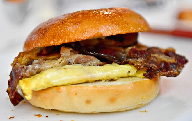 A beef bacon, egg and white cheddar cheese bagel is shown The Breakfast Store inside Penn Market in York City, Saturday, Feb. 17, 2024. (Dawn J. Sagert/The York Dispatch)