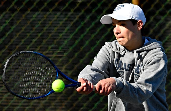 Dallastown’s Jacob Horn returns the ball to Cumberland Valley’s Bahv Singh (not pictured) during tennis action at Dallastown Area High School in York Township, Thursday, March 21, 2024. (Dawn J. Sagert/The York Dispatch)