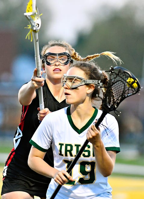 York Catholic’s Molly Janusz, front, moves the ball down the field while Susquehannock’s Erin Jackson defends during girls’ lacrosse action at York Catholic High School in York City, Thursday, April 18, 2024. York Catholic would win the game 8-4. (Dawn J. Sagert/The York Dispatch)
