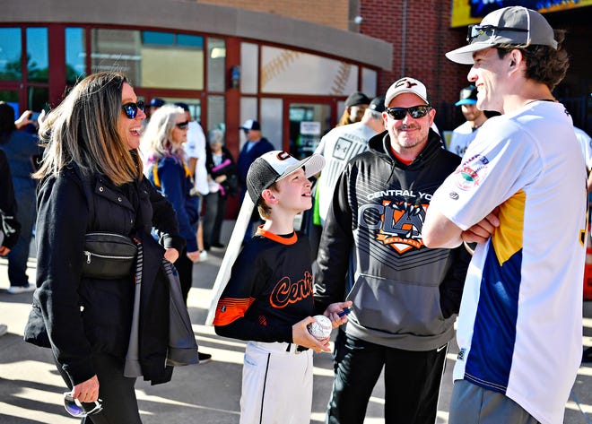 From left, Jen Gladfelter, Austin Gladfelter, 9, and Nate Gladfelter, all of Springettsbury Township, talk with York Revolution catcher Robert Chesney during Fan Fest at WellSpan Park in York City, Saturday, April 20, 2024. (Dawn J. Sagert/The York Dispatch)