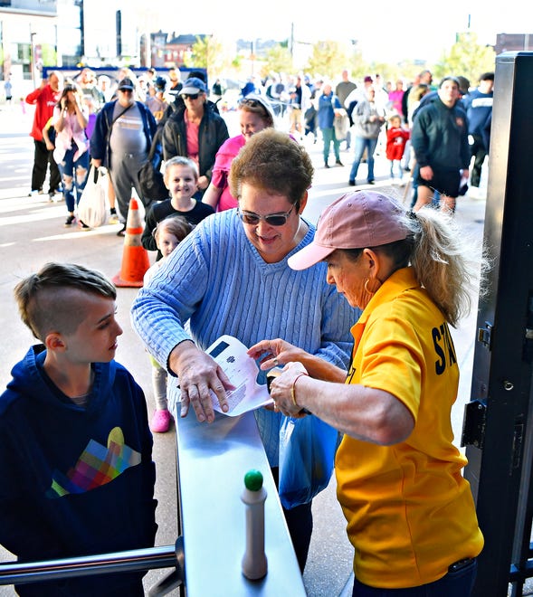 From right, Linda Hess, of York City, scans the tickets of Trena Stonebraker, of Manchester Township, and her grandson Cole Youngblood, 9, of Hallam Township, during York Revolution’s Fan Fest at WellSpan Park in York City, Saturday, April 20, 2024. (Dawn J. Sagert/The York Dispatch)