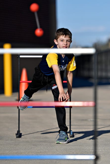 Jason Carbaugh, 9, of Codorus Township, plays ladder ball during York Revolution’s Fan Fest in the Brooks Robinson Plaza at WellSpan Park in York City, Saturday, April 20, 2024. (Dawn J. Sagert/The York Dispatch)
