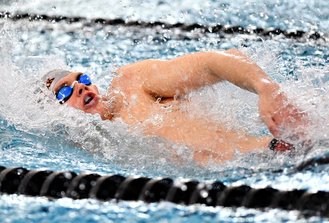 Central York's Jared Hicks competes in the 100 Yard Backstroke event during the York-Adams League Swimming Championship at Central York High School in Springettsbury Township, Saturday, Feb. 9, 2019. Dawn J. Sagert photo