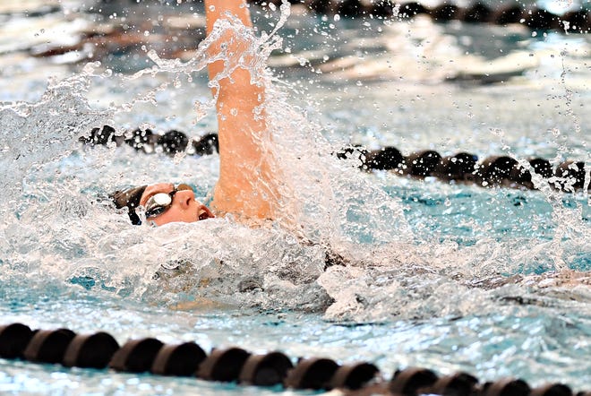 York Suburban's Maddy Abel competes in the 100 Yard Backstroke event during York-Adams League Swimming Championship at Central York High School in Springettsbury Township, Saturday, Feb. 9, 2019. Dawn J. Sagert photo