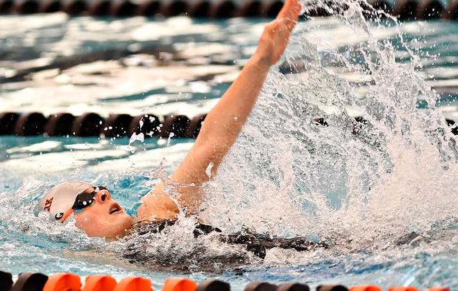 Central York's Camryn Leydig competes in the 100 Yard Backstroke event during the York-Adams League Swimming Championship at Central York High School in Springettsbury Township, Saturday, Feb. 9, 2019. Leydig would win the event at 56.67. Dawn J. Sagert photo