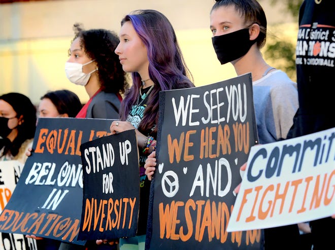 Central York High School students, from left, Tehya Shaw, Maddison Smith and Sierra Peyton, protest the school's ban on books and other teaching materials by black and Hispanic authors during a rally outside the school Wednesday, Sept. 8, 2021. The Panther Anti-Racist Union–a student organization–organized the protest which they say will occur daily until Sept. 13, the date of the next district school board meeting. Bill Kalina photo