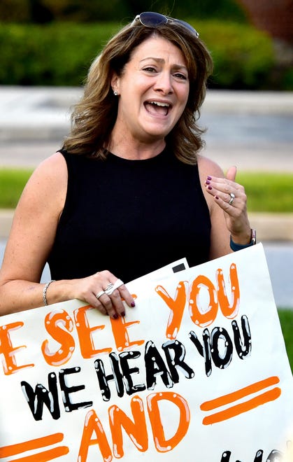 Central York School Board candidate Amy Milsten speaks during a demonstration outside the Central York School District Administration offices before a school board meeting there Monday, Sept. 13, 2021. The rally was in opposition to a banned resource list instituted by the district, which demonstrators say targets minority authors. Bill Kalina photo
