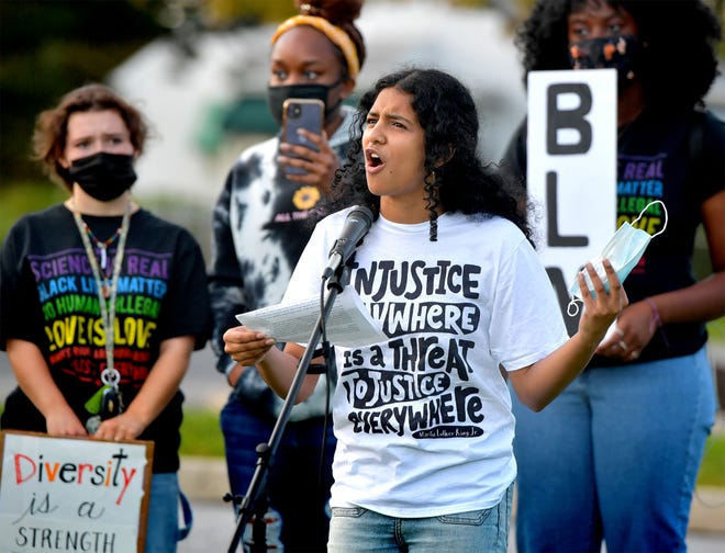 Panther Anti-Racist Student Union organizer Edha Gupta speaks at rally outside the Central York School District Administration offices before a school board meeting there Monday, Sept. 20, 2021. The rally was in opposition to a banned resource list instituted by the district, which demonstrators say targets minority authors. District officials added formal discussion of the ban to Monday's agenda. Gupta is a Central York High School senior. Bill Kalina photo