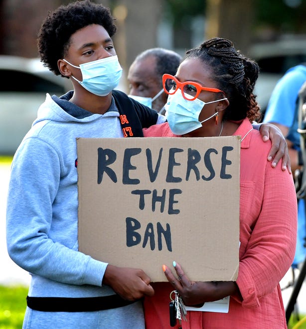 Sonja Holland and her son, Isaiah, attend a rally outside the Central York School District Administration offices before a school board meeting there Monday, Sept. 20, 2021. Isaiah is an eighth-grader at Central York Middle School. The rally was in opposition to a banned resource list instituted by the district, which demonstrators say targets minority authors. District officials added formal discussion of the ban to Monday's agenda. Bill Kalina photo