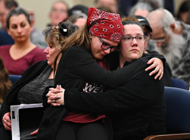 Hayden Zile, 13, left, embraces her mother Deidre Carter, both of Manchester Township, during Northeastern School District’s Board of School Directors work session at the Northeastern School District Administrative Center in Manchester, Monday, March 6, 2023. During the public comment session of the meeting, Hayden and her grandmother, Michelle Long, at immediate left, spoke about the bullying that Hayden experiences at Northeastern Middle School. Dawn J. Sagert photo