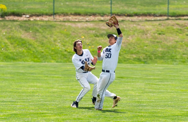 Penn State York's Eli Weigle (2), left, and teammate Christopher Sangermano (50) almost colliding as they made a play against Penn State Wilkes-Barre during their baseball game in Spry on Tuesday, Apr. 25, 2023.