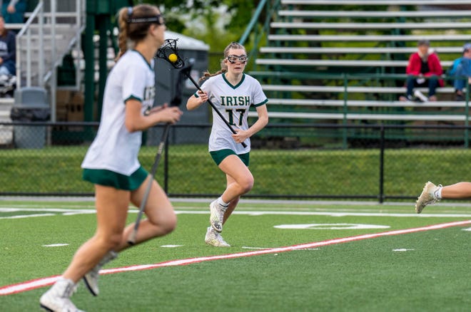 York Catholic's Katie Bullen (17) against Dallastown during their girls lacrosse game in York on Thursday, May 4, 2023.