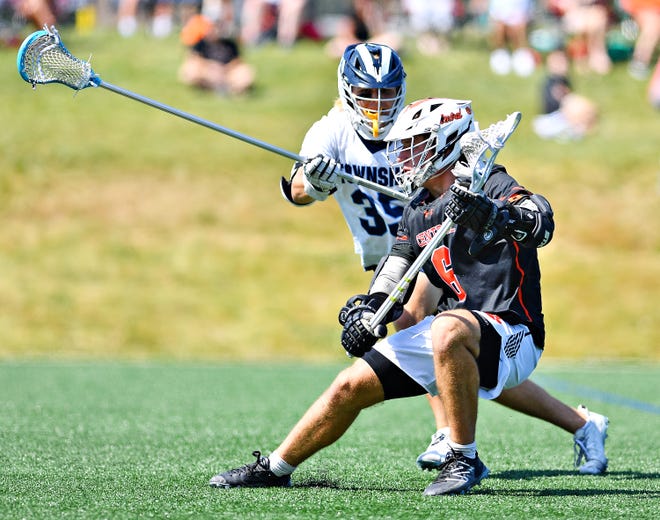 Central York’s Dayton Bagwell, front, controls the ball while Manheim Township’s Austin Day defends during PIAA District 3, Class 3-A boys’ lacrosse championship action at Manheim Township High School, Thursday, June 1, 2023. Manheim Township would win the game 17-10. Dawn J. Sagert photo